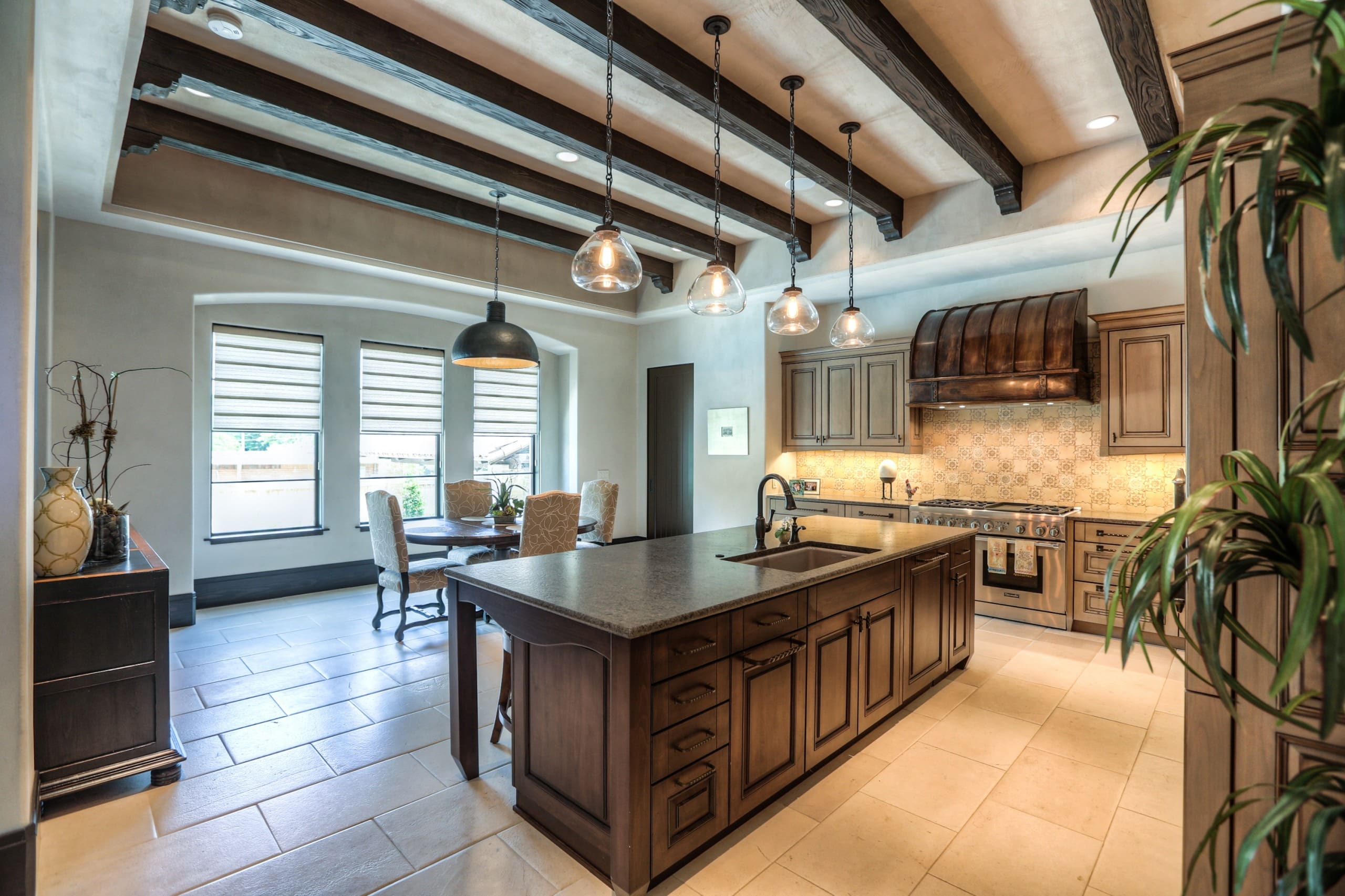 Spacious kitchen with island and dining area.
